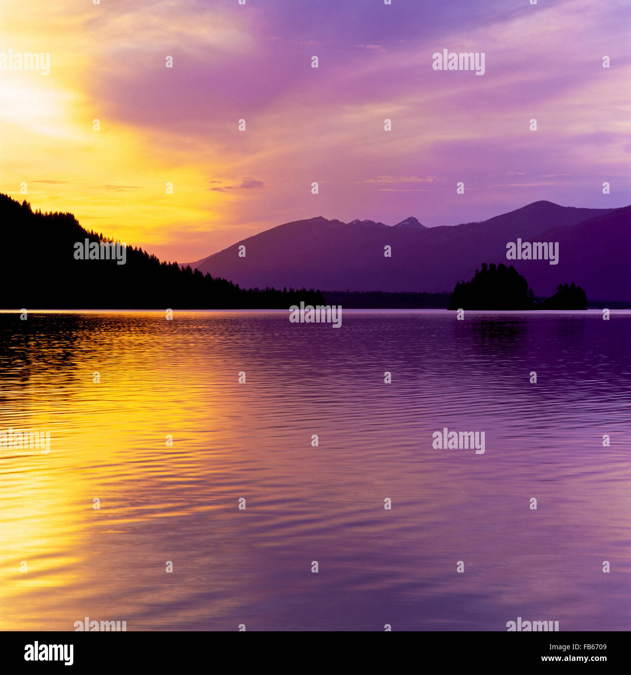 sunset over noxon reservoir and the mountains near noxon