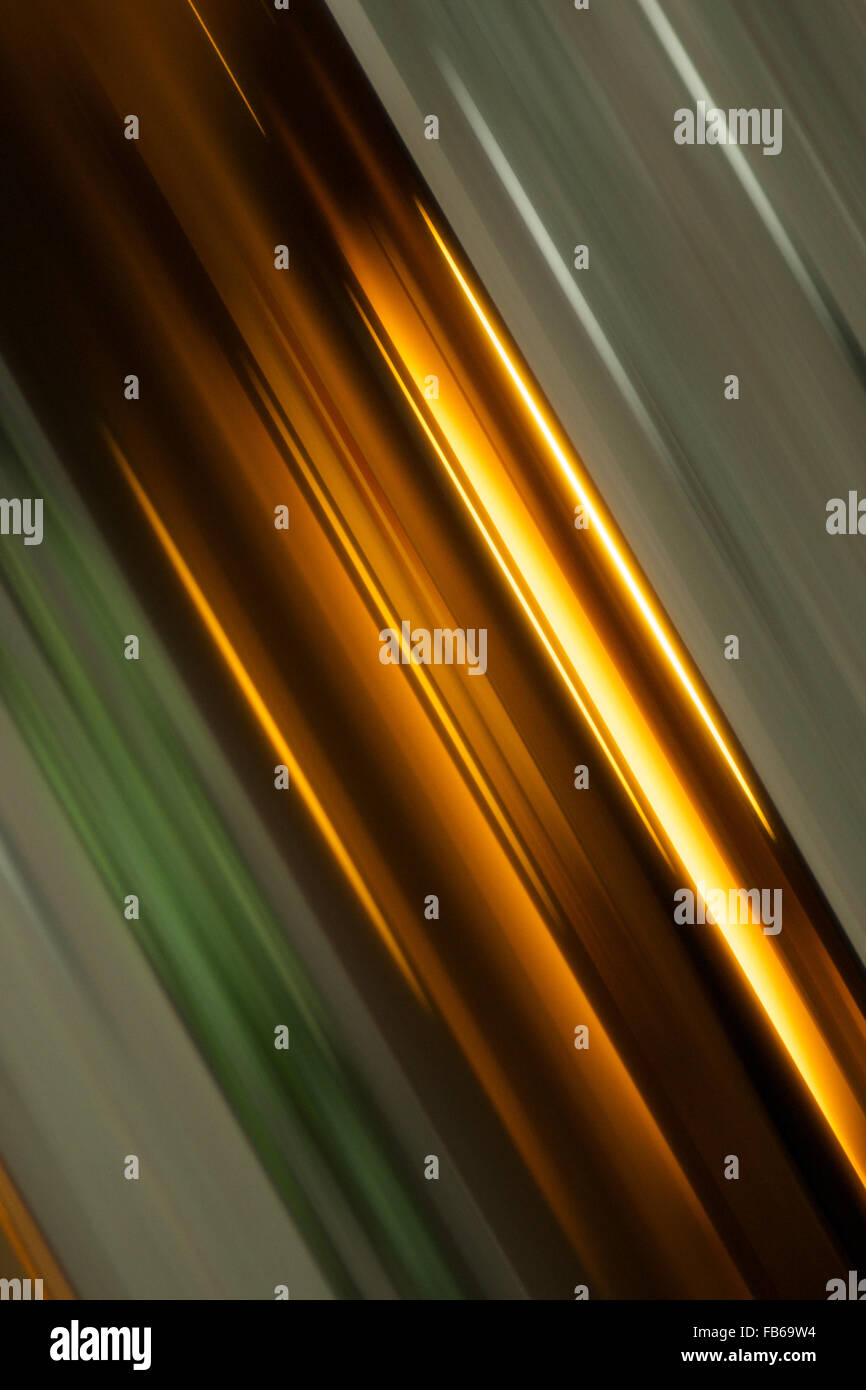 Abstract angled streaks of green and gold Stock Photo - Alamy