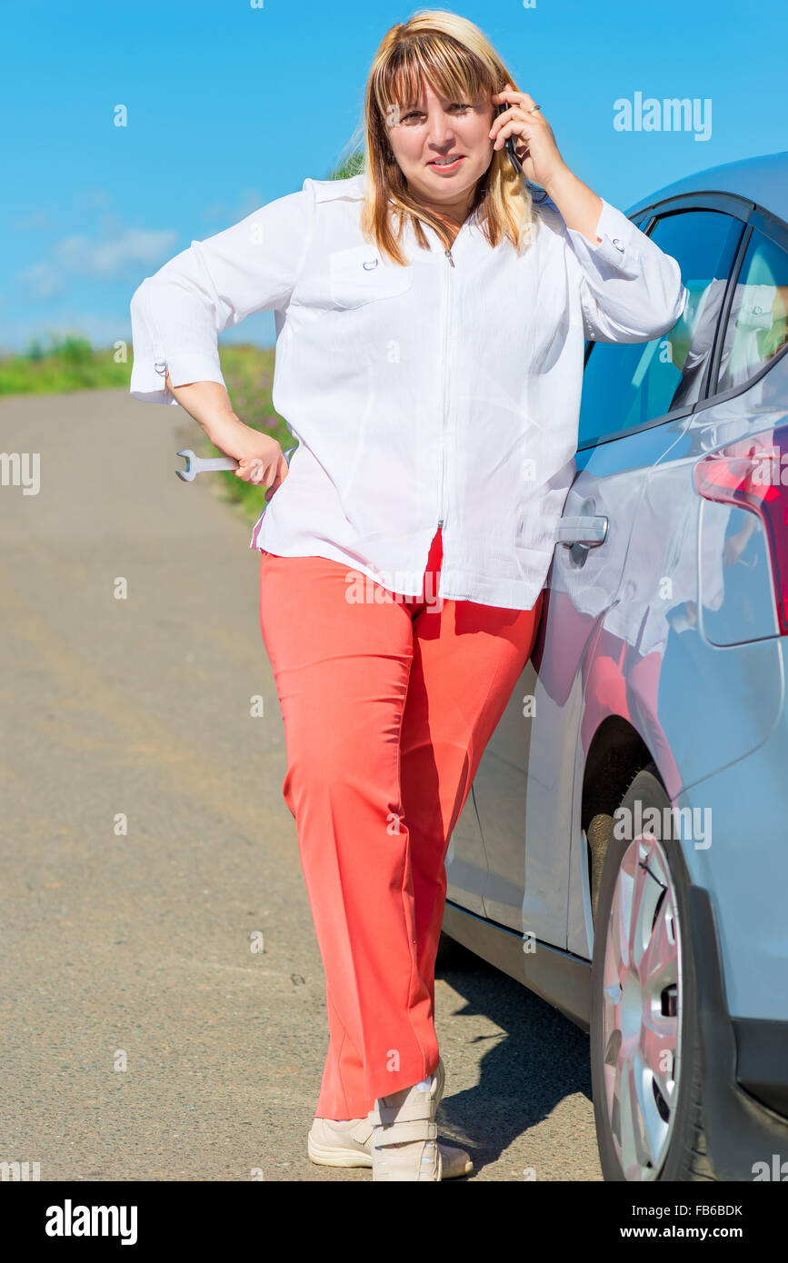 driver woman and a broken car on the road Stock Photo - Alamy