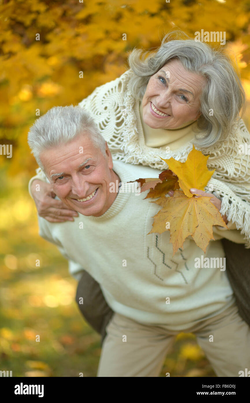 Senior couple in autumn park Stock Photo - Alamy