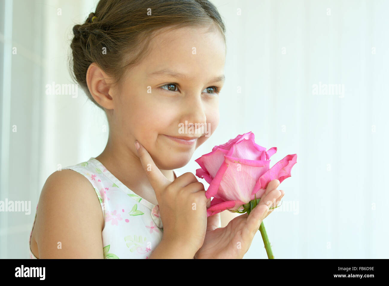 Little girl with rose flower Stock Photo Alamy