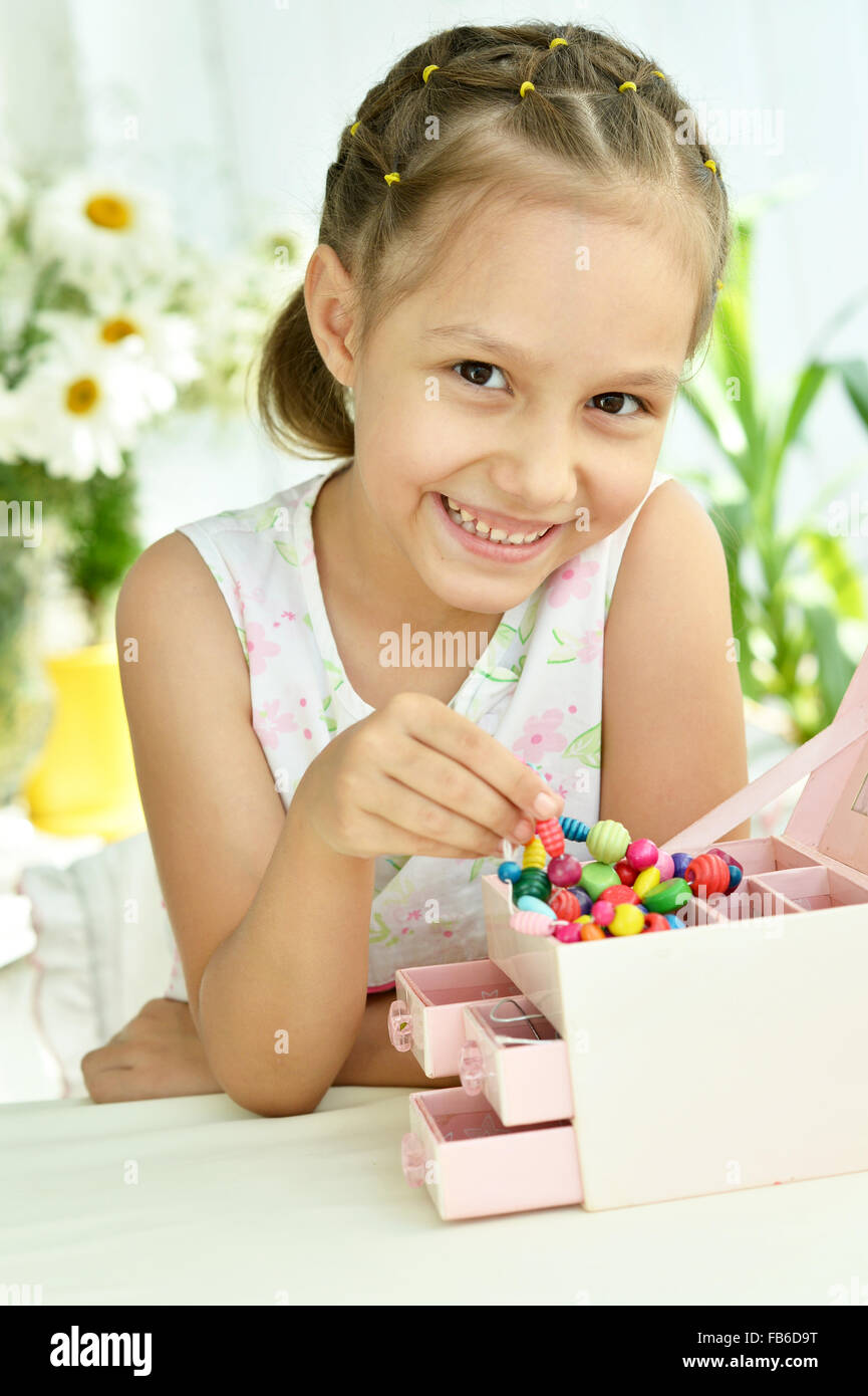 Cute Little girl with beads Stock Photo Alamy