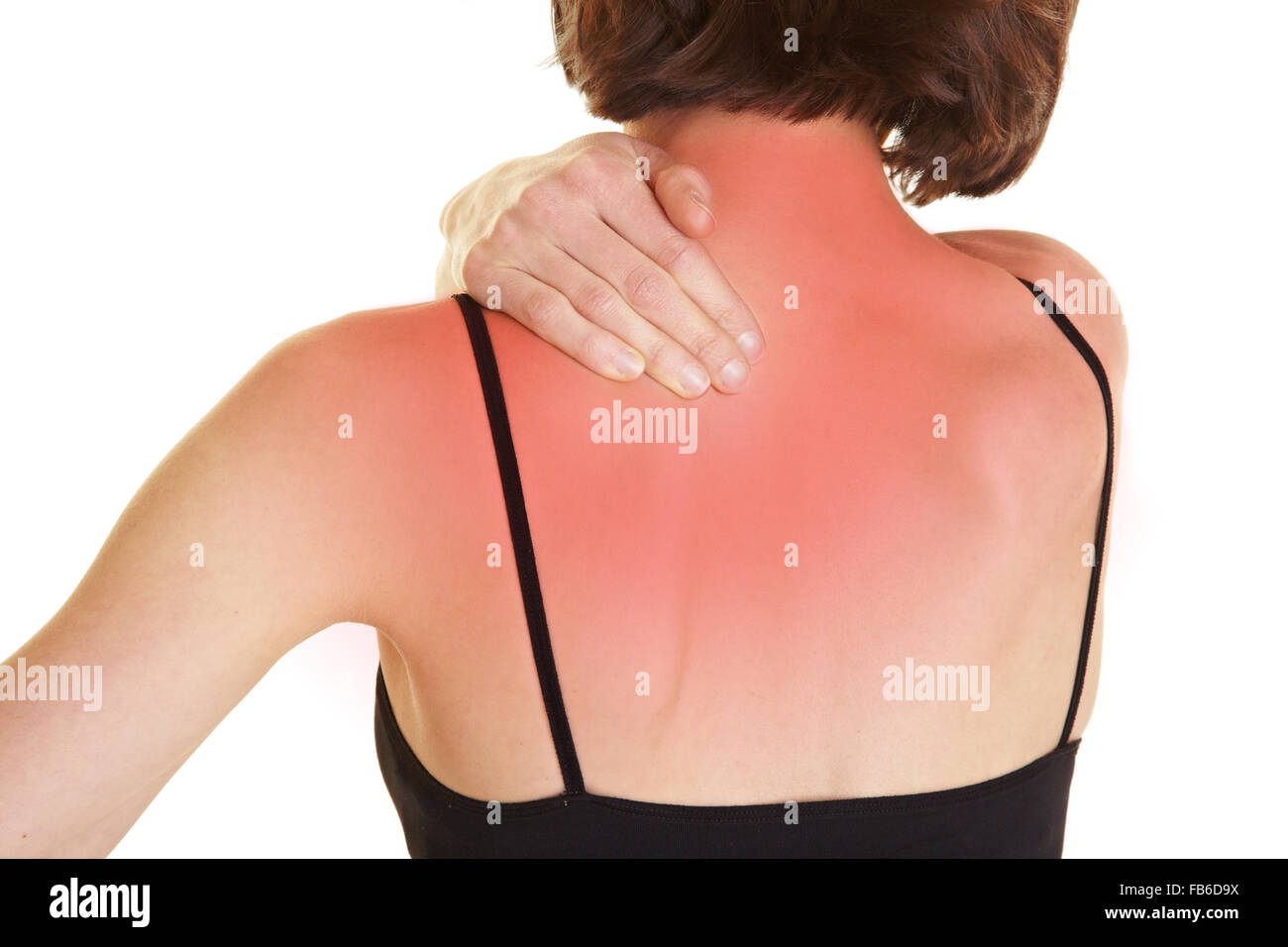 Young woman massaging her red aching back Stock Photo