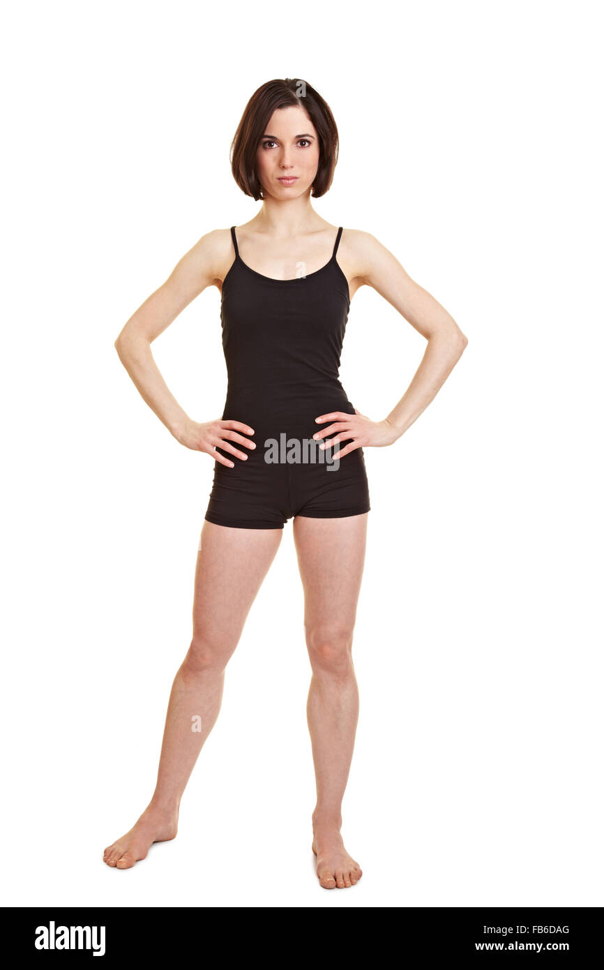 Full body shot of slim sportive woman with her arms akimbo Stock Photo -  Alamy