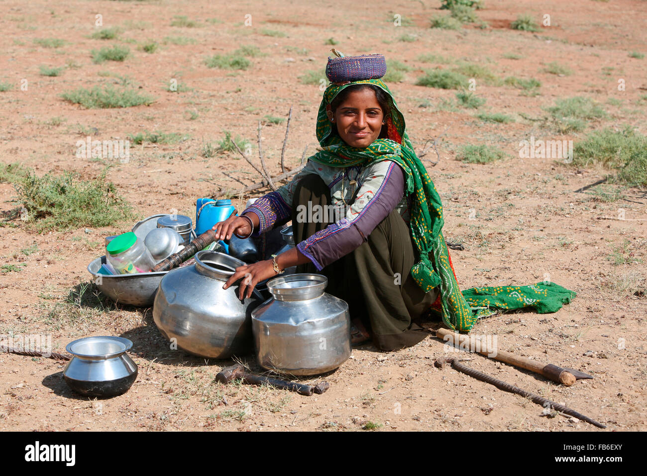 Dhebaria Rabari (DHEBAR) Woman sitting with water pots, Kutch, Gujarat, India Stock Photo