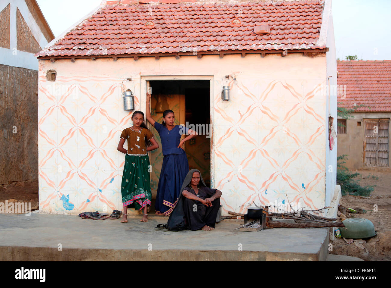 Kacchi Rabari (Desi), Laharia Village, Woman with grand daughters in front of home, Kutch District, Gujarat, India Stock Photo