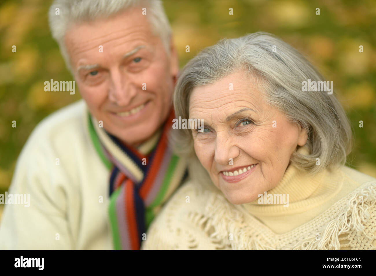 Senior couple in autumn park Stock Photo - Alamy