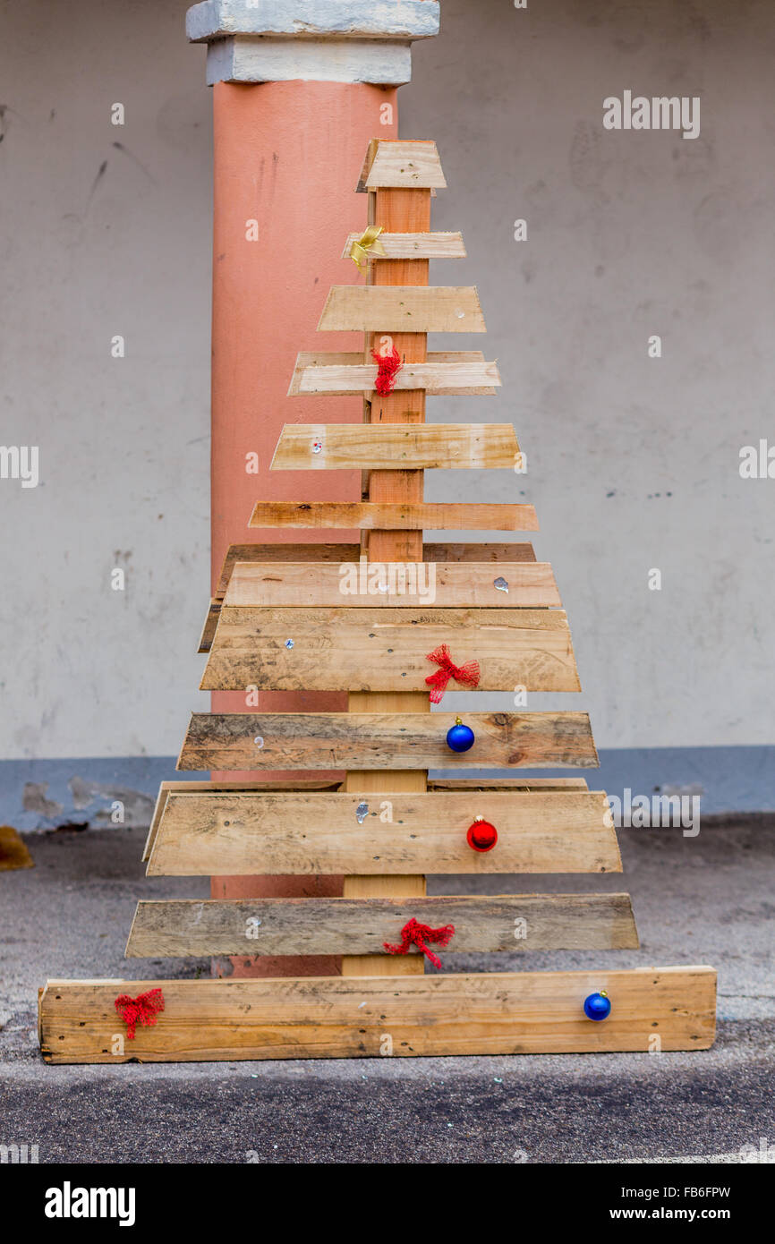 poor and simple Christmas tree made with grunge wood boards Stock Photo