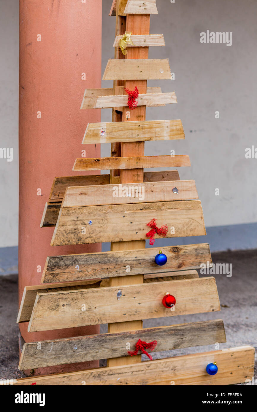 poor and simple Christmas tree made with grunge wood boards Stock Photo
