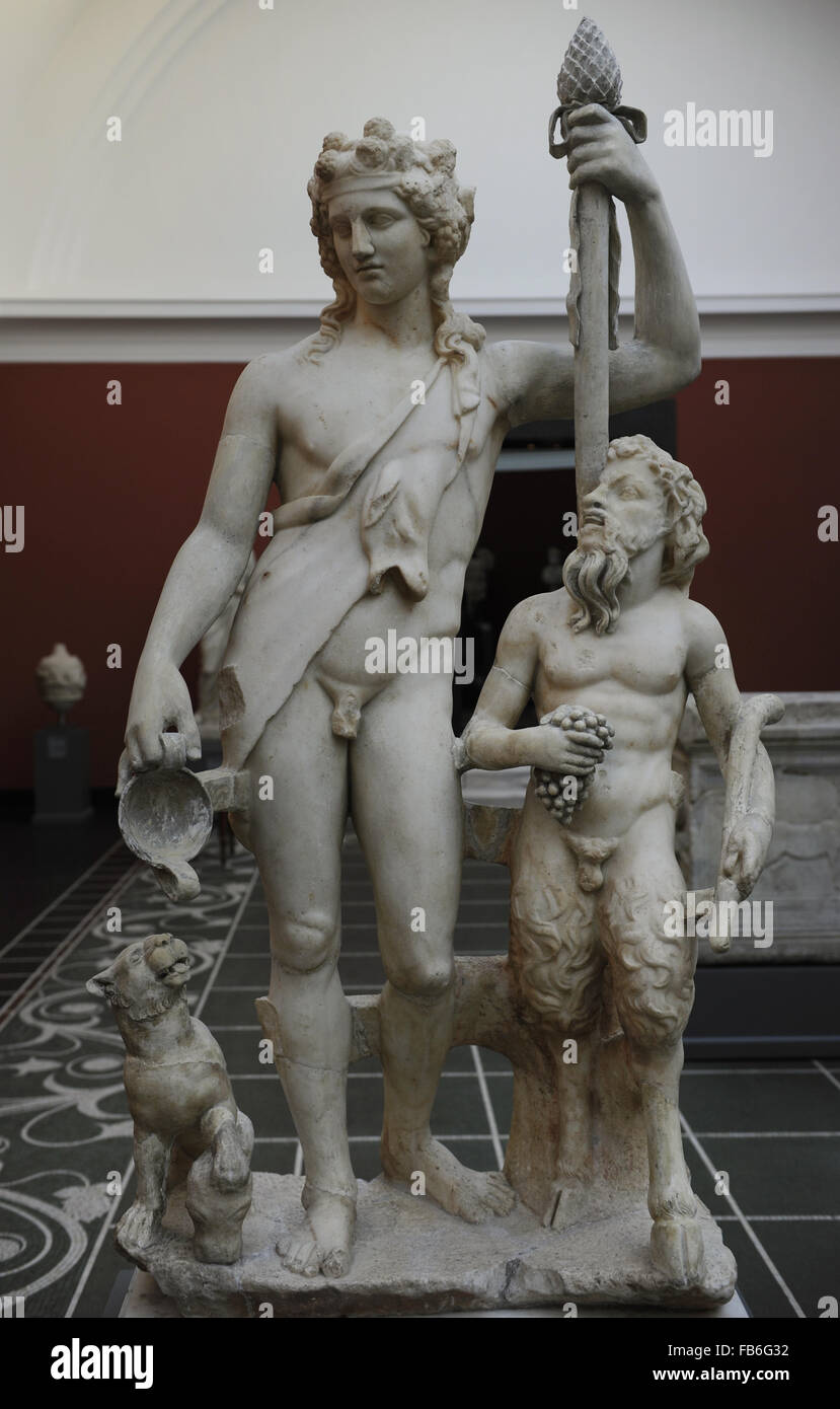 Bacchus (Roman) also known as Dionysus (Greek). God of the grape harvest in classical mythology. Statue of Bacchus with satyr and panther. From roman Villa of Pozzuoli, near Naples, Italy. 2nd century AD. Marble. Ny Carlsberg Glyptotek. Copenhagen, Denmark. Stock Photo