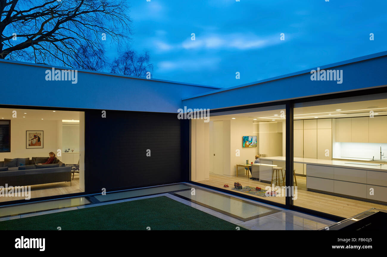 Dusk view. Courtyard House, London, United Kingdom. Architect Canaway