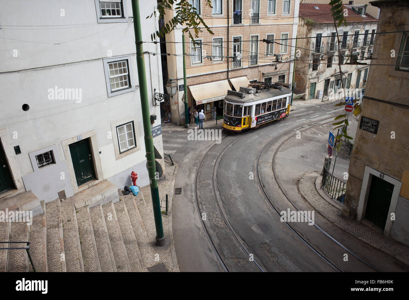 Traditional vintage tram nr 28 in old city of Lisbon in Portugal Stock Photo