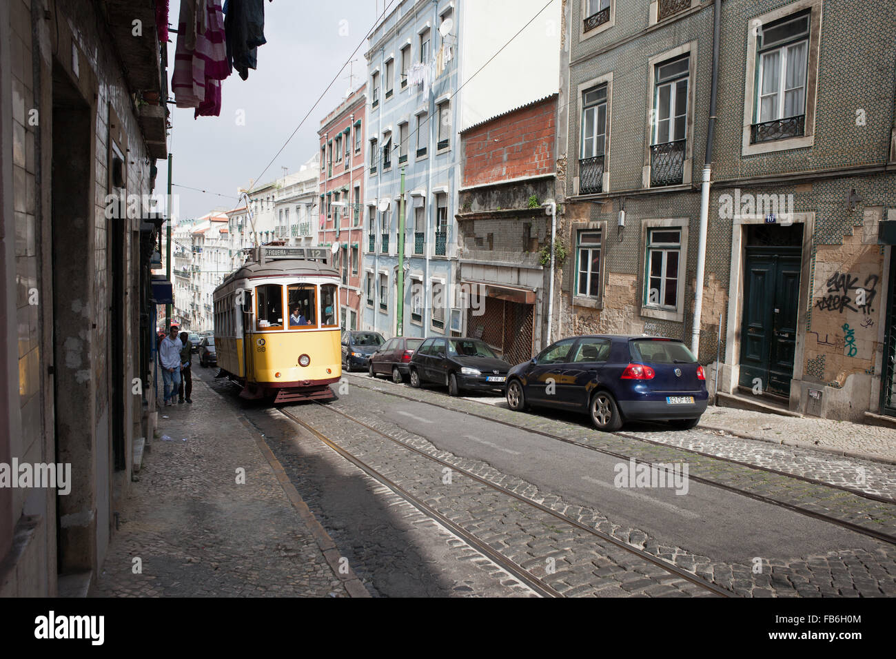 City of Lisbon in Portugal, street with tramline, route 12 Stock Photo