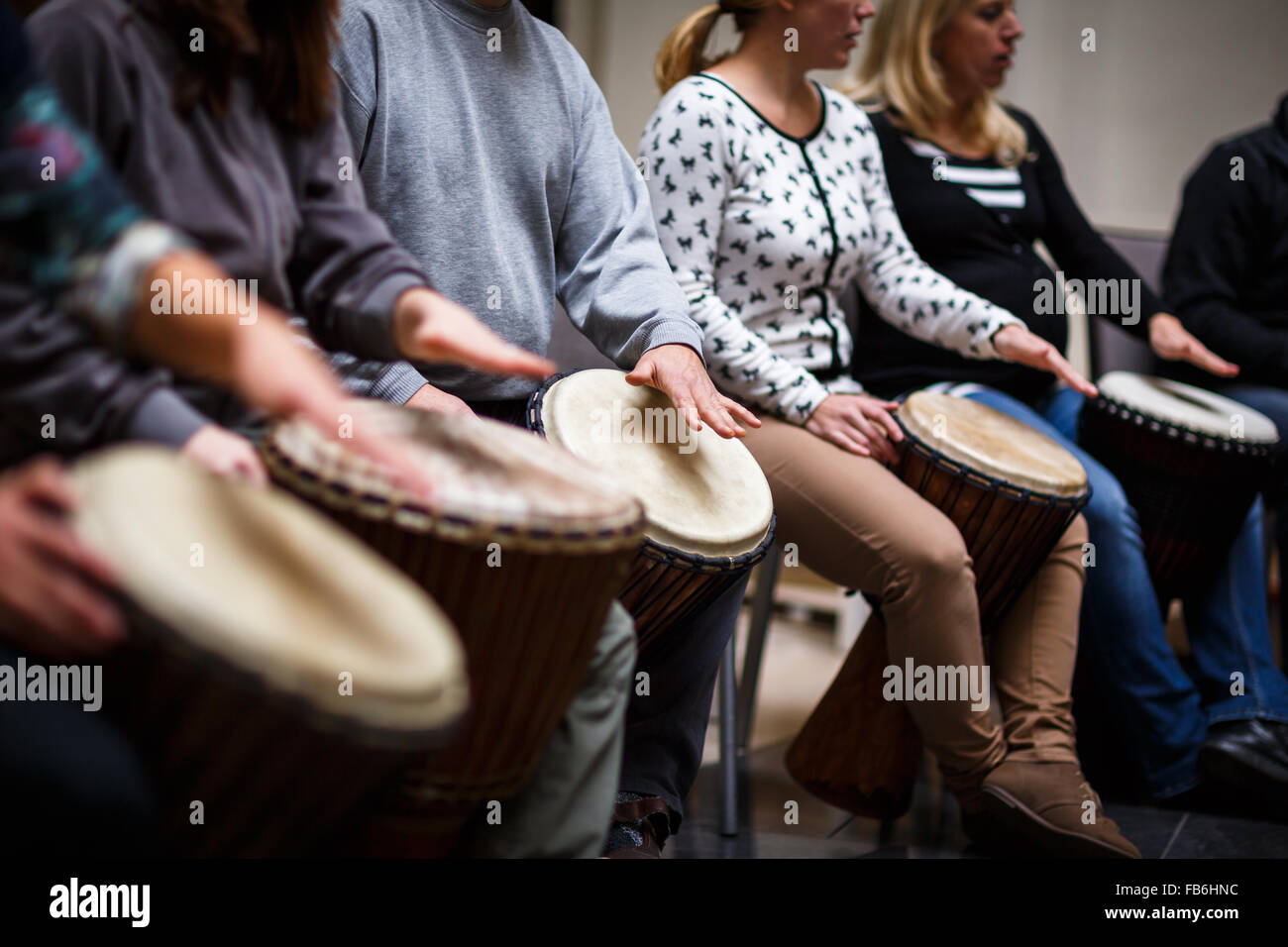 Group of people playing on drums therapy by music Stock Photo Alamy