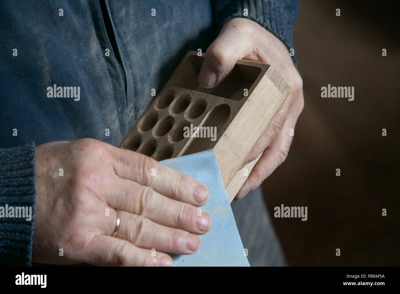 Man polishing sandpaper tree in one studio Stock Photo Alamy