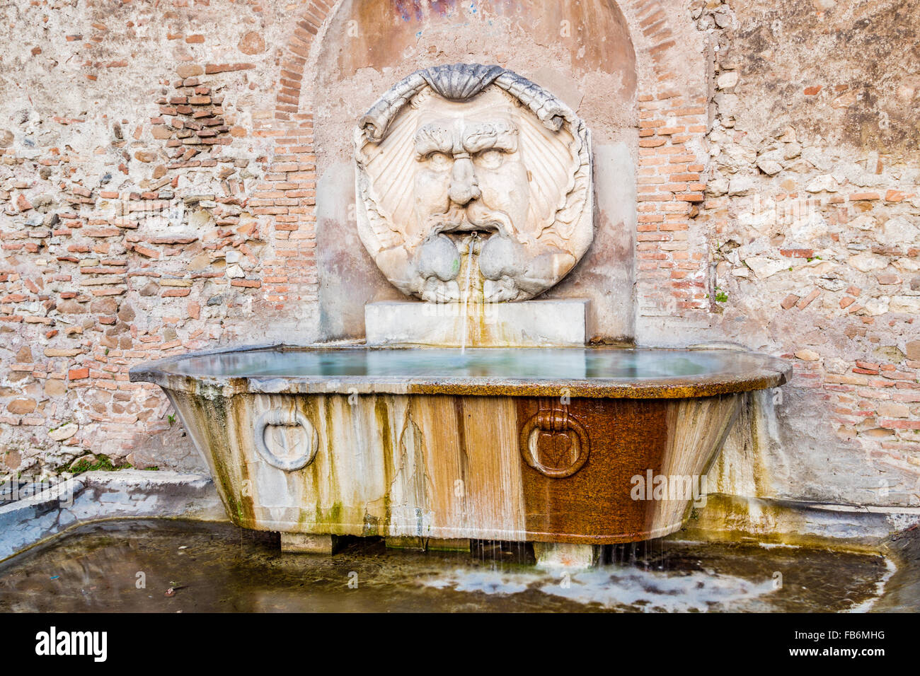 Ancient Roman fountain of the mask in Rome, Italy Stock Photo Alamy