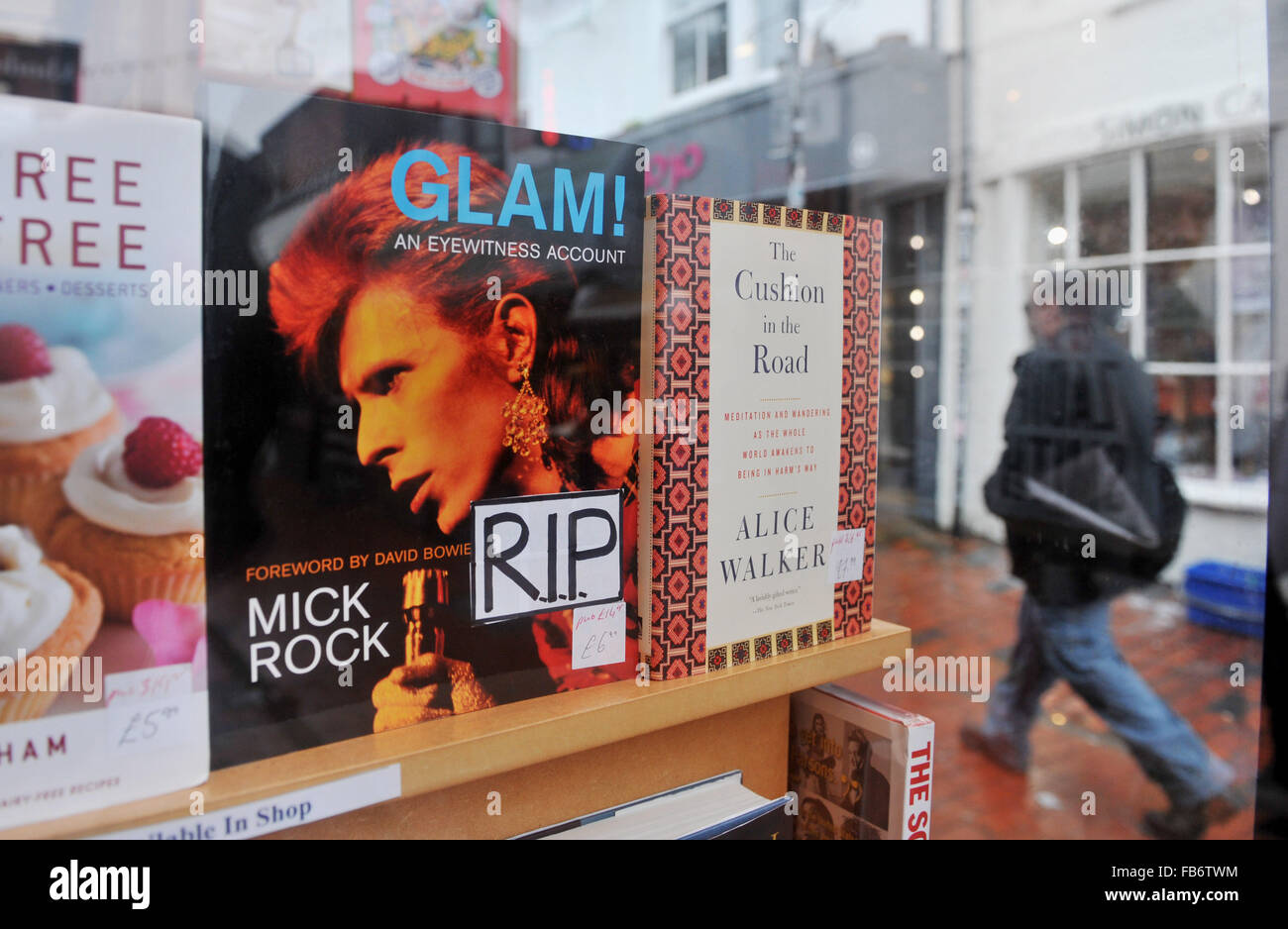 Brighton, UK. 11th January, 2016. Glam! An Eyewitness Account by Mick Rock with a front cover photograph of David Bowie which has had an RIP sticker added in the PS Brighton bookshop window in the North Laine area of the city after his death was announced earlier today  Credit:  Simon Dack/Alamy Live News Stock Photo