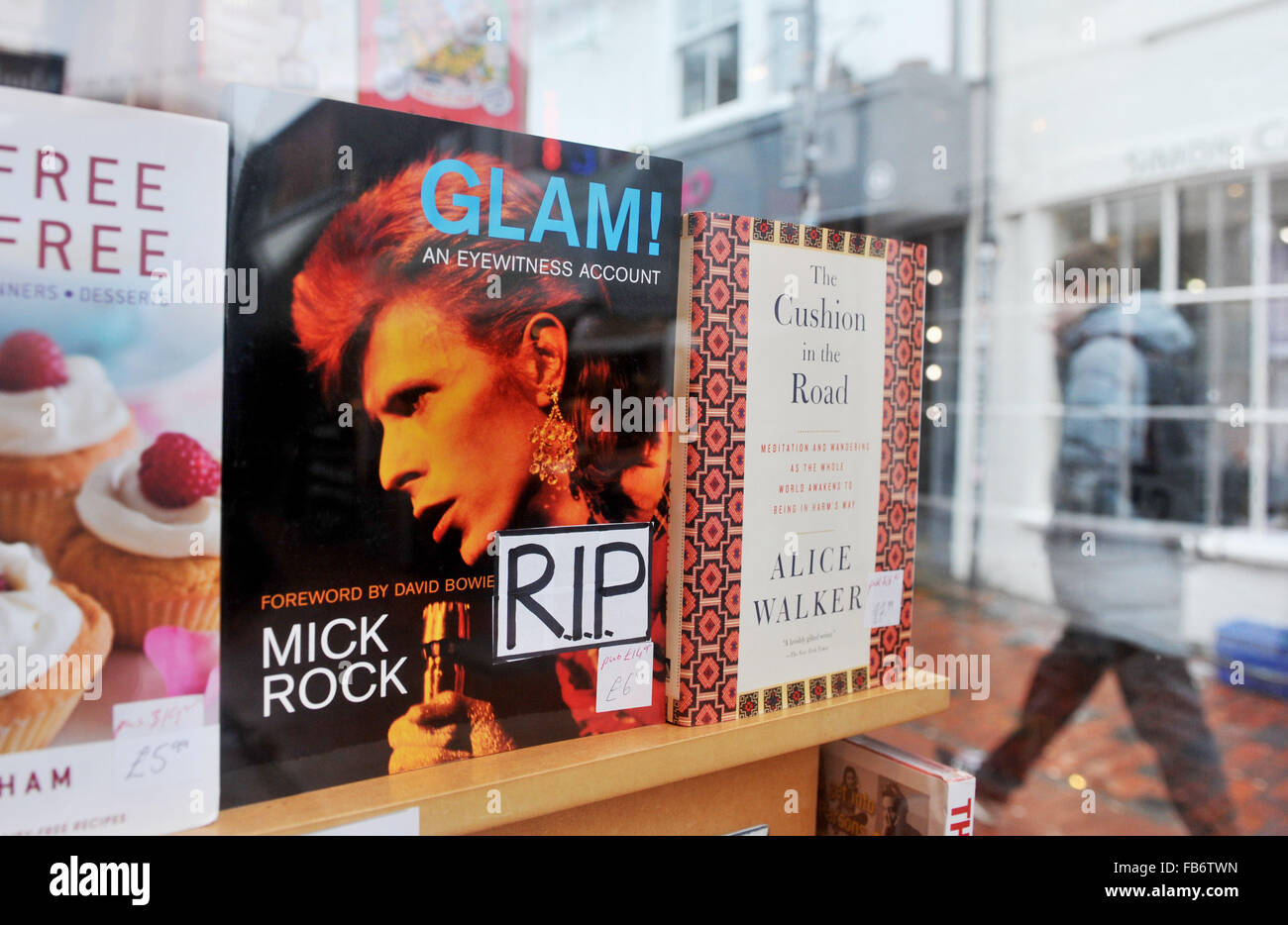 Brighton, UK. 11th January, 2016. Glam! An Eyewitness Account by Mick Rock with a front cover photograph of David Bowie which has had an RIP sticker added in the PS Brighton bookshop window in the North Laine area of the city after his death was announced earlier today  Credit:  Simon Dack/Alamy Live News Stock Photo