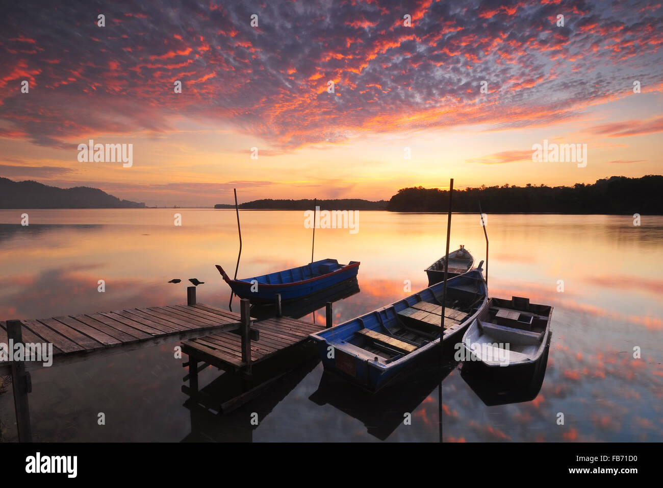 Dramatic clouds sky at sunrise with reflections on the water Stock ...