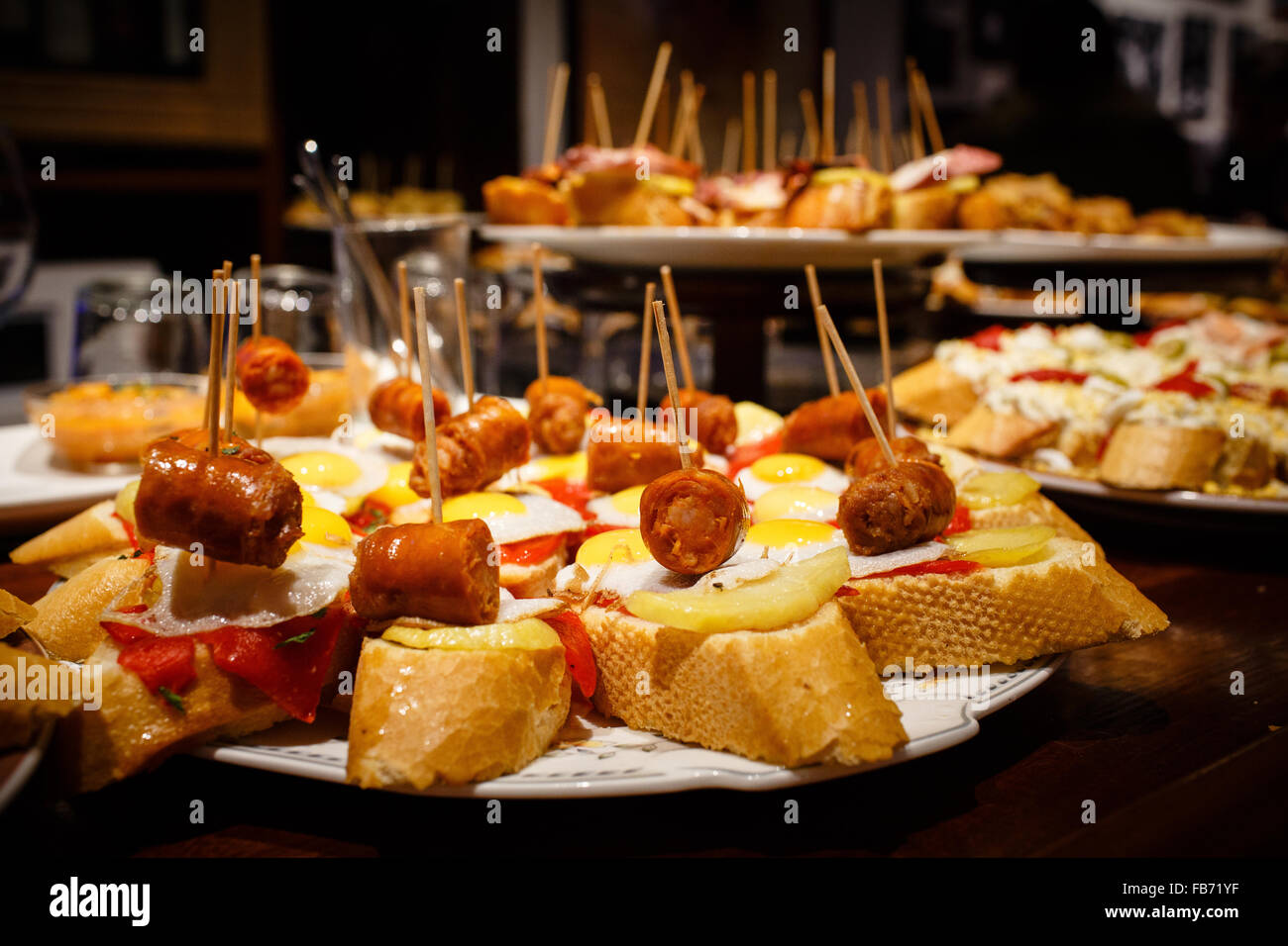 1/4/15 Chorizo, potato and fried egg tapas on display, Casa Alcalde, c/ Negusia, San Sebastián, Basque Country, Spain. Stock Photo