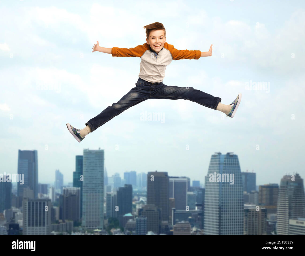 happy smiling boy jumping in air Stock Photo - Alamy