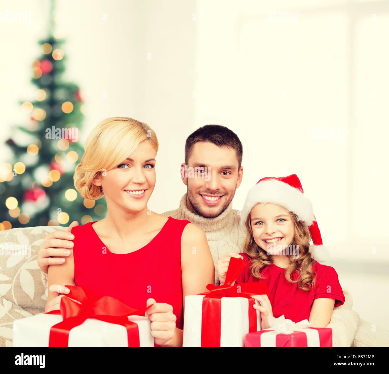 smiling family holding many gift boxes Stock Photo - Alamy