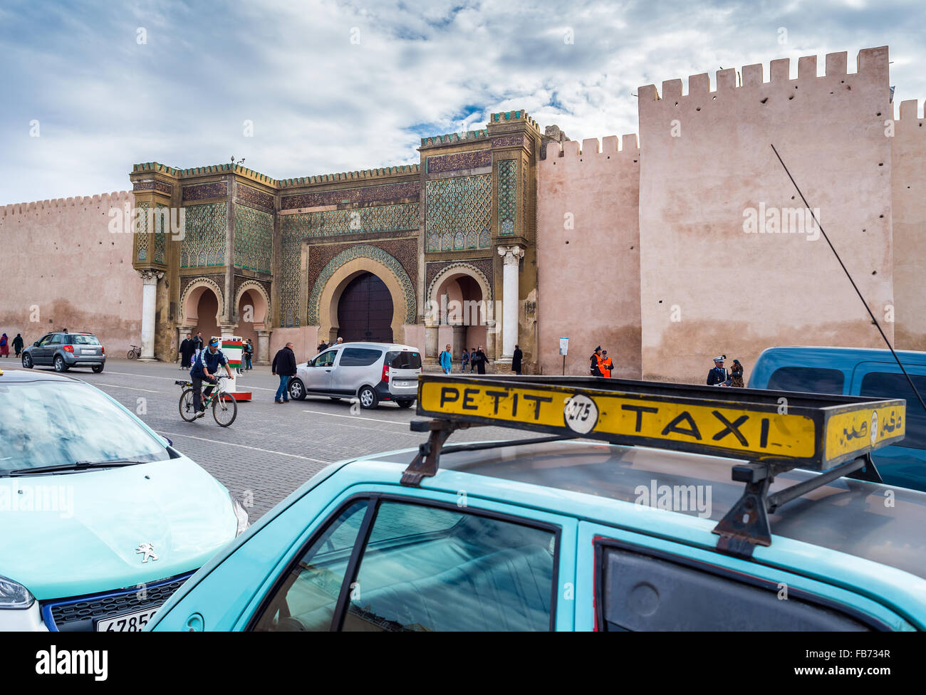 Taxi rank with Petit Taxis front of The Bab el Mansour in medina of Meknes. Morocco. Stock Photo