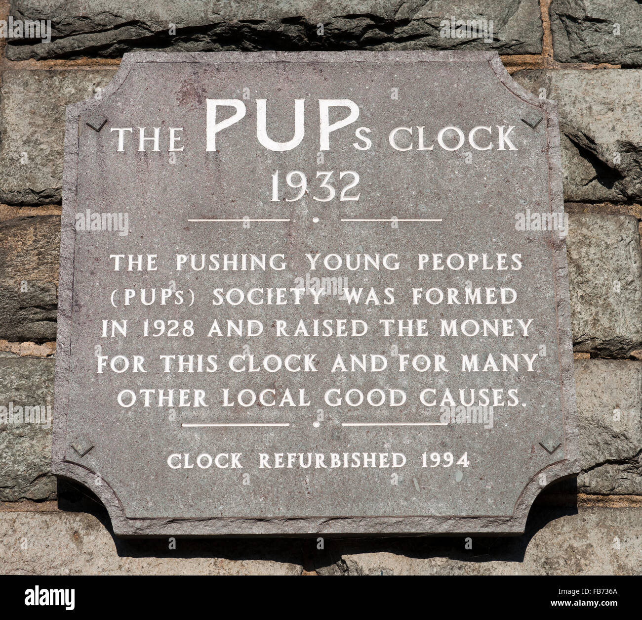 Plaque for The Pups Clock, Main Street, Keswick, Cumbria, England, UK. Stock Photo