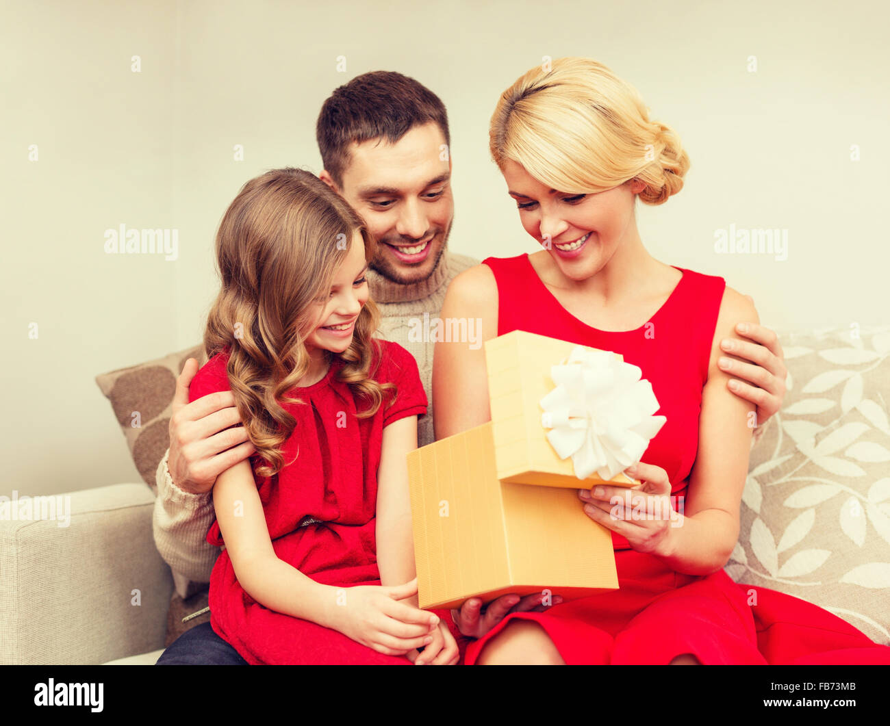 happy family opening gift box Stock Photo - Alamy