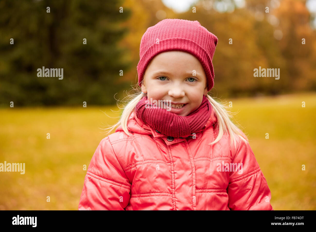 happy little girl in autumn park Stock Photo - Alamy
