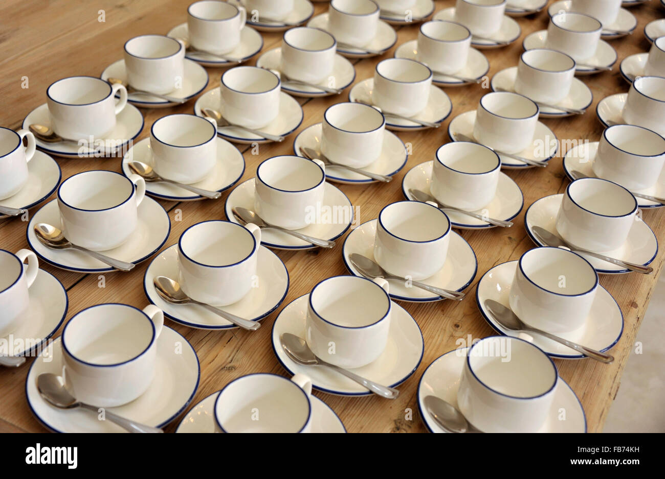 Tea or coffee cups in line ready for a meeting refreshment break Stock