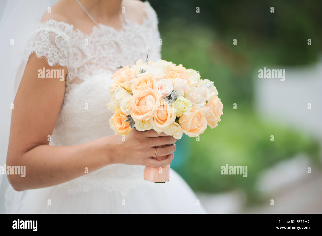 Bride holding a bouquet of flowers, wedding bouquet Stock Photo - Alamy