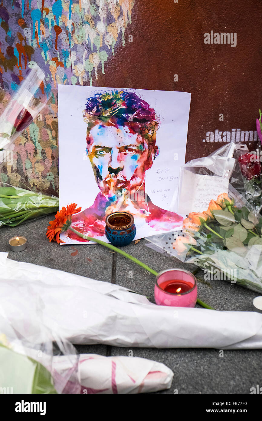 A mural of David Bowie with tributes and flowers Stock Photo