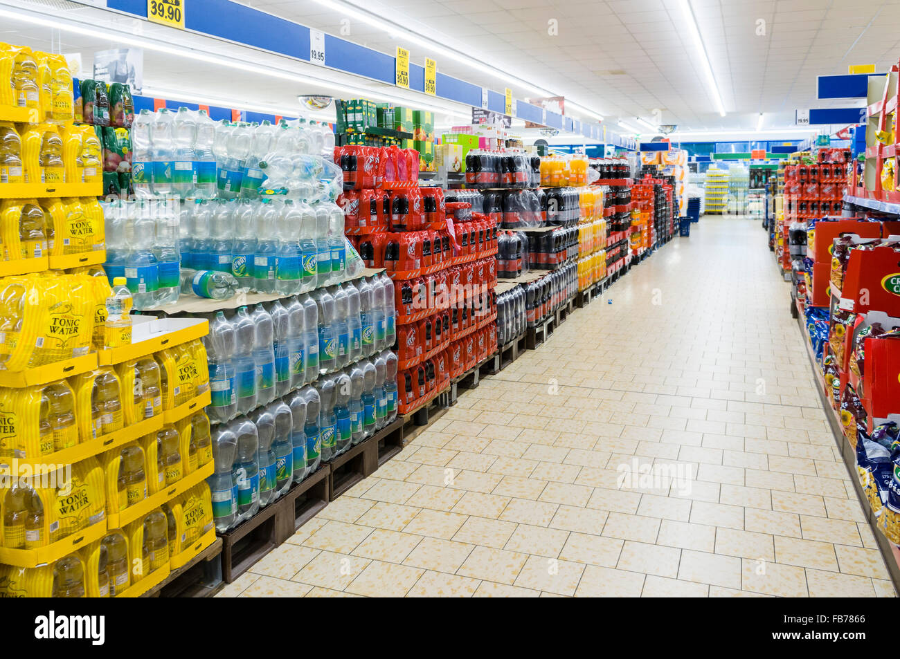 Bottled soft soda drinks and snacks aisle in Lidl, the German discount supermarket chain.  Model Release: No.  Property Release: No. Stock Photo