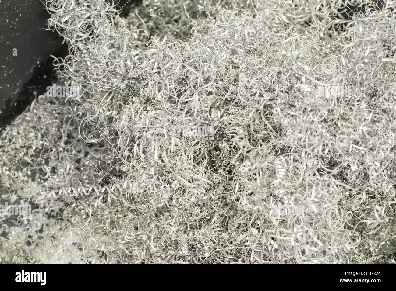 Textured metal shaving scrap background, shallow DOF Stock Photo
