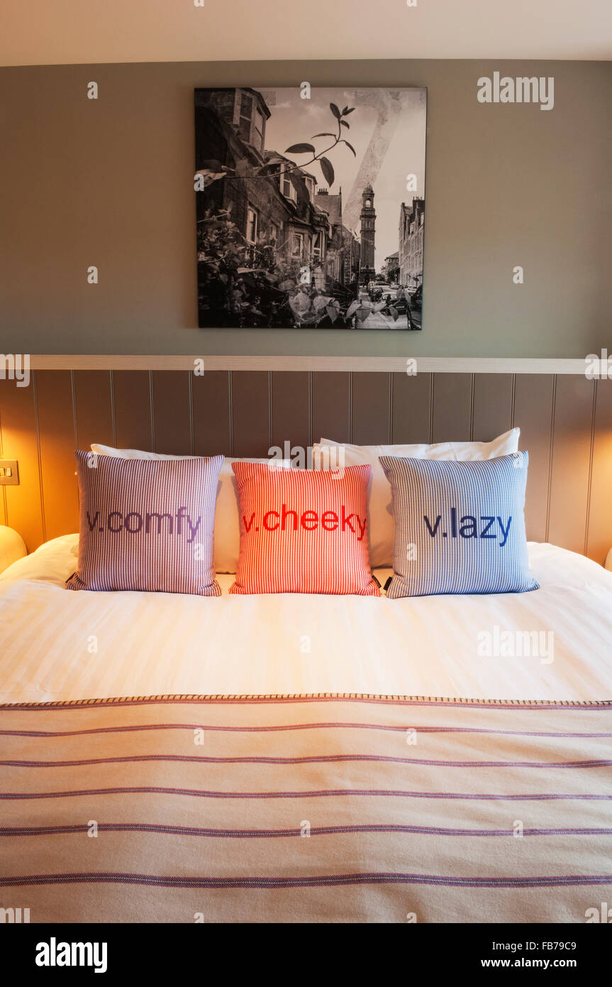 Bed in a cosy bedroom in a modern hotel, Aberdeen, Scotland. Stock Photo
