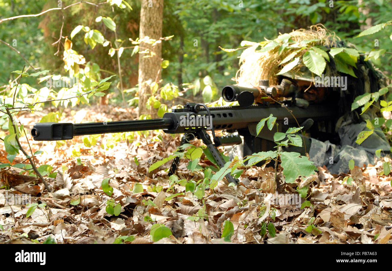 A U.S. Army sniper using an M107. Sniper with Barrett M82 Stock Photo
