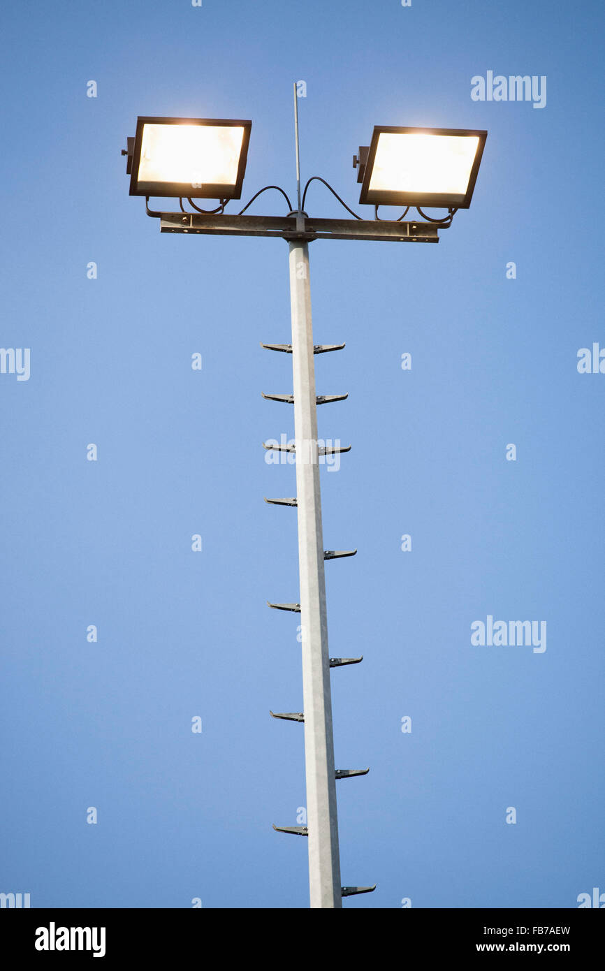 Low angle view of floodlight against clear sky Stock Photo