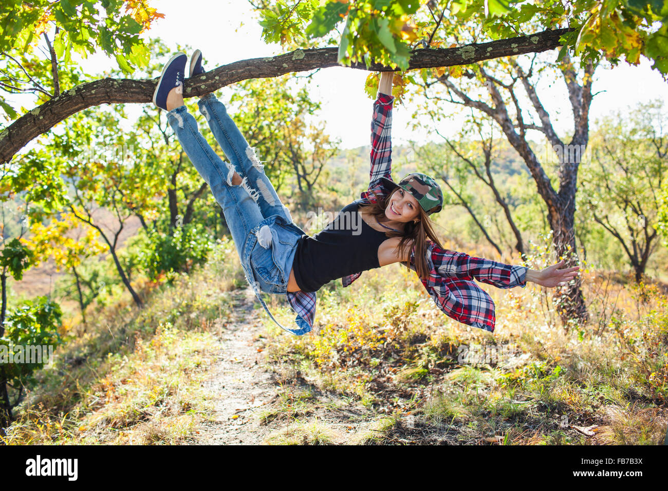 Woman climbing tree hires stock photography and images Alamy
