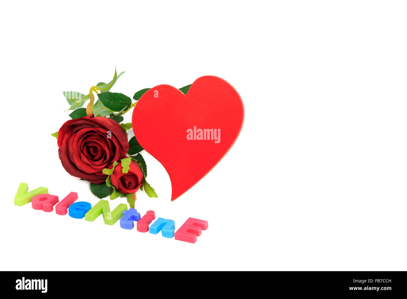 Valentines day red rose, red funky heart and colourful letters spelling Valentine isolated on white background Stock Photo