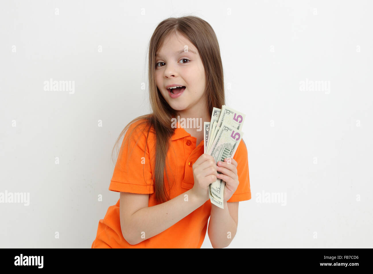 Beautiful kid and cash money Stock Photo