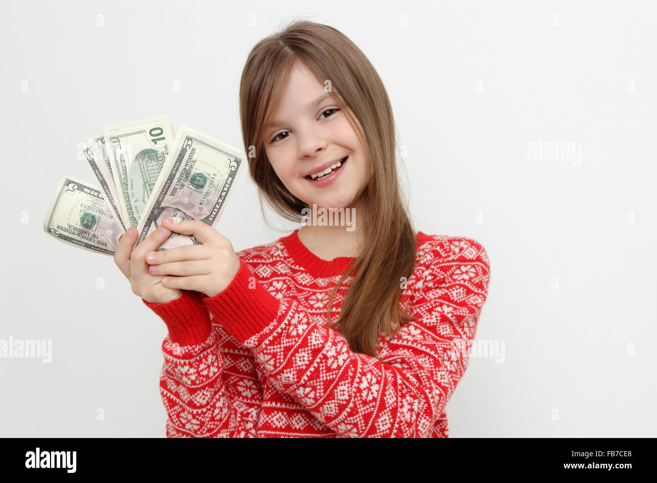 Beautiful kid and cash money Stock Photo