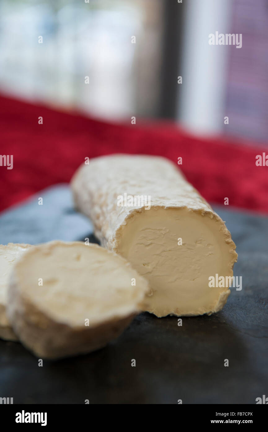 Matured goats cheese log with a creamywhite mould rind. Ragstone by