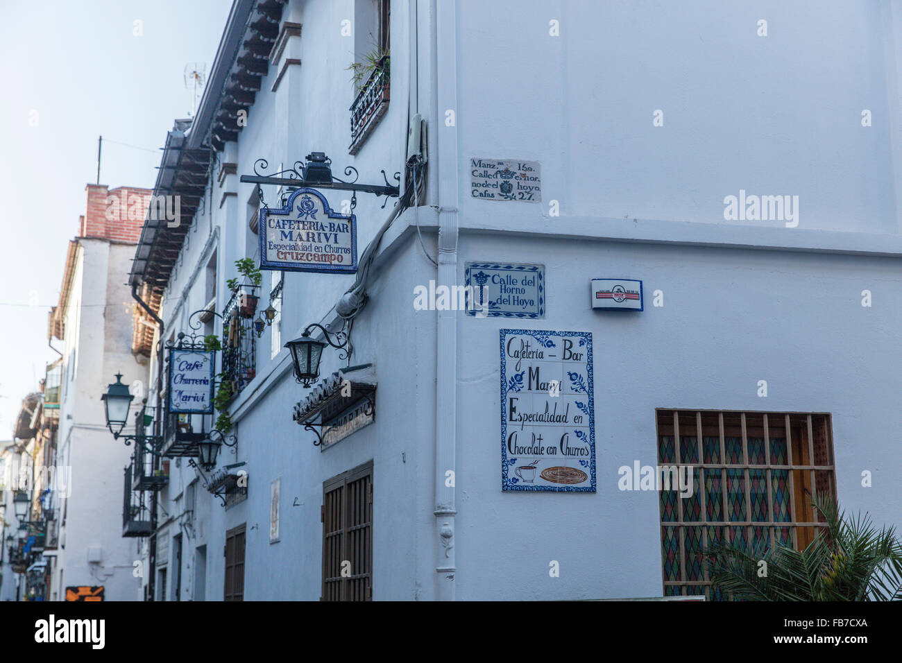 White walls of a restaurant and bar in the Albaicin district of Granada in Spain with ceramic tiles on the walls. Stock Photo