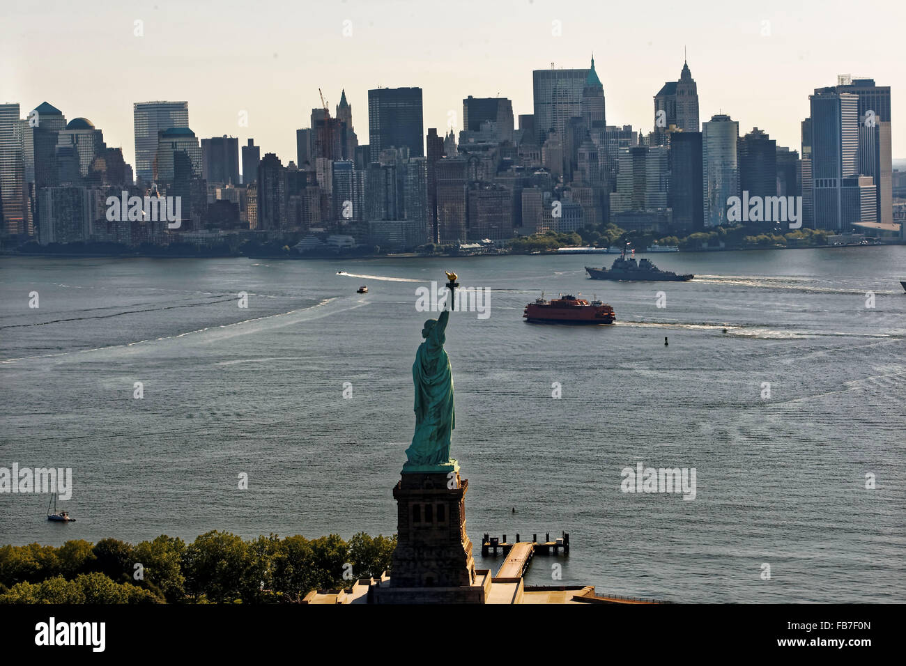 The Statue of Liberty sits at the entrance to New York Harbor. Stock Photo