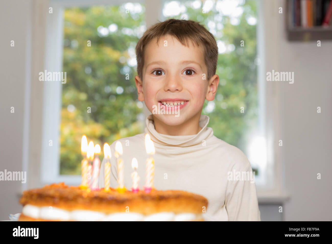 Portrait of happy birthday boy at home Stock Photo