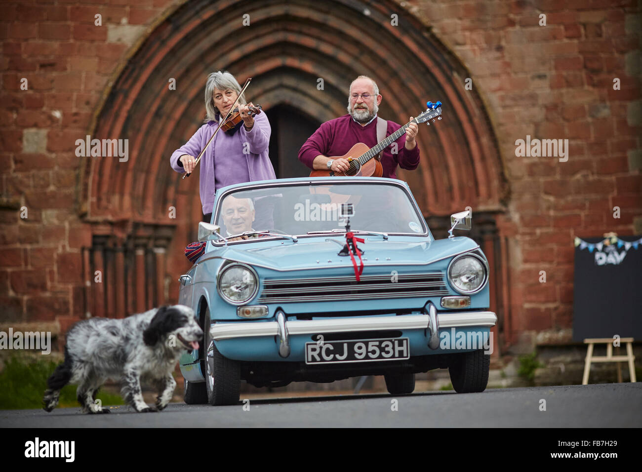 BBC Music day 'for the love of music'  Hadrian's Wall of Sound 2015 at Lanercost Priory Triumph Hearld convertible Violin duet M Stock Photo