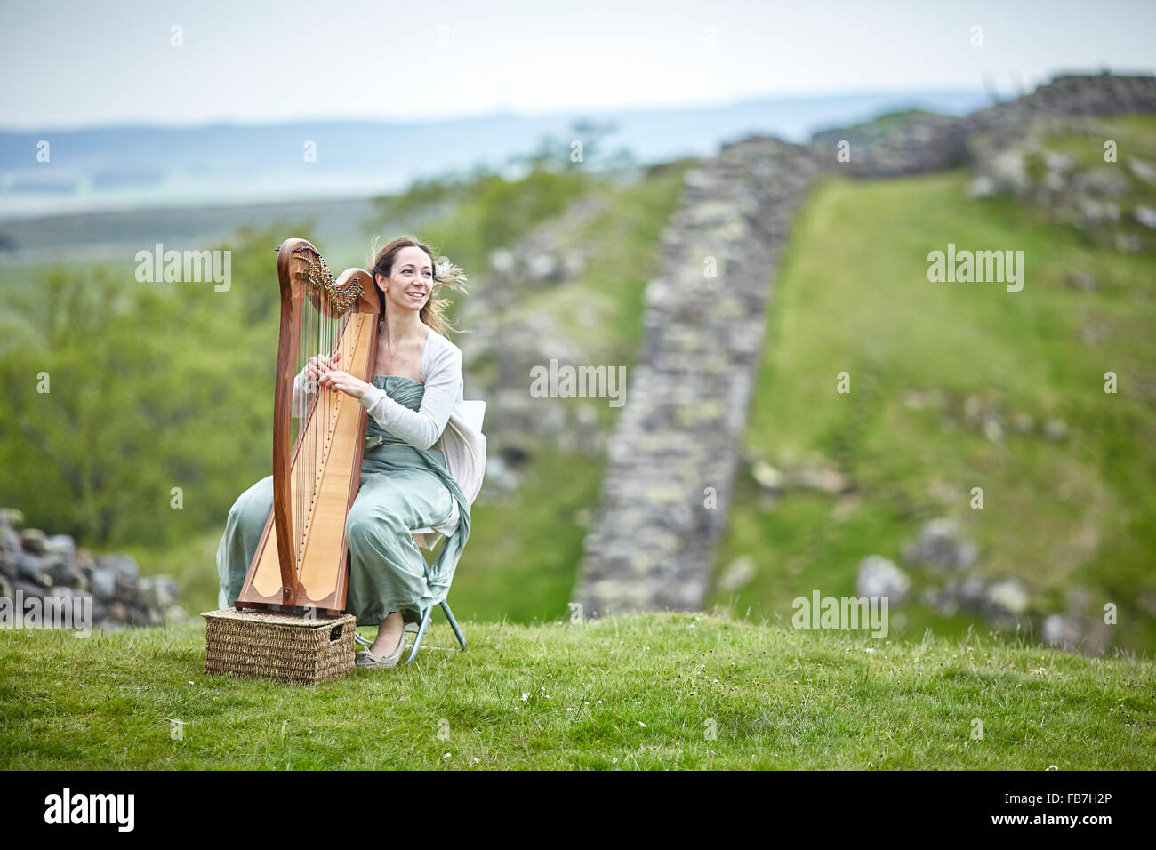 BBC Music day 'for the love of music'  Hadrian's Wall of Sound 2015 at Cumbria and Northumberland Gilsland  harp player landscape Stock Photo