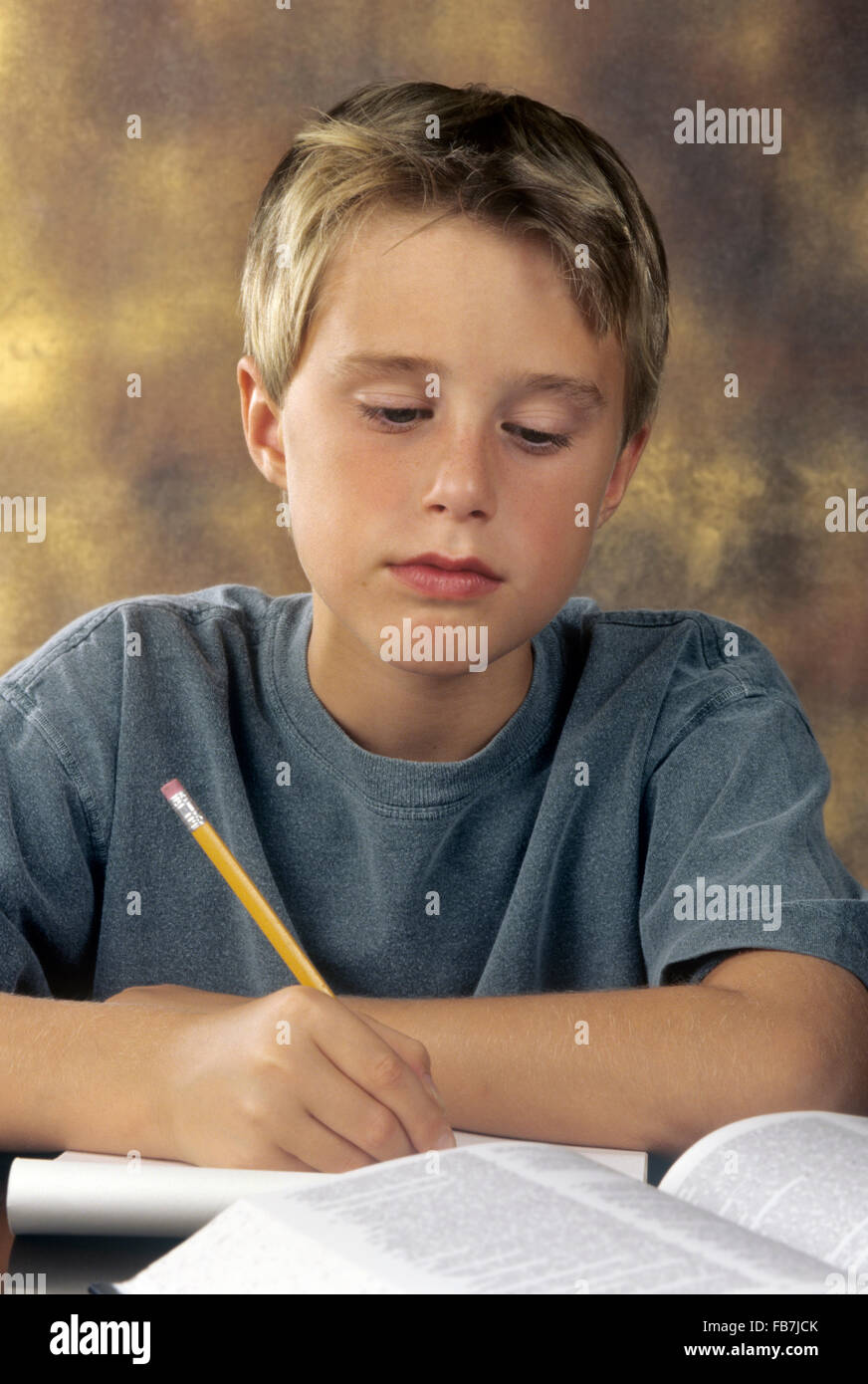 boy doing homework Stock Photo
