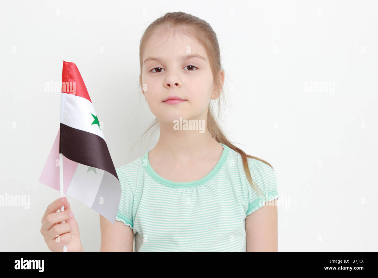 Teen girl holding Syria flag Stock Photo